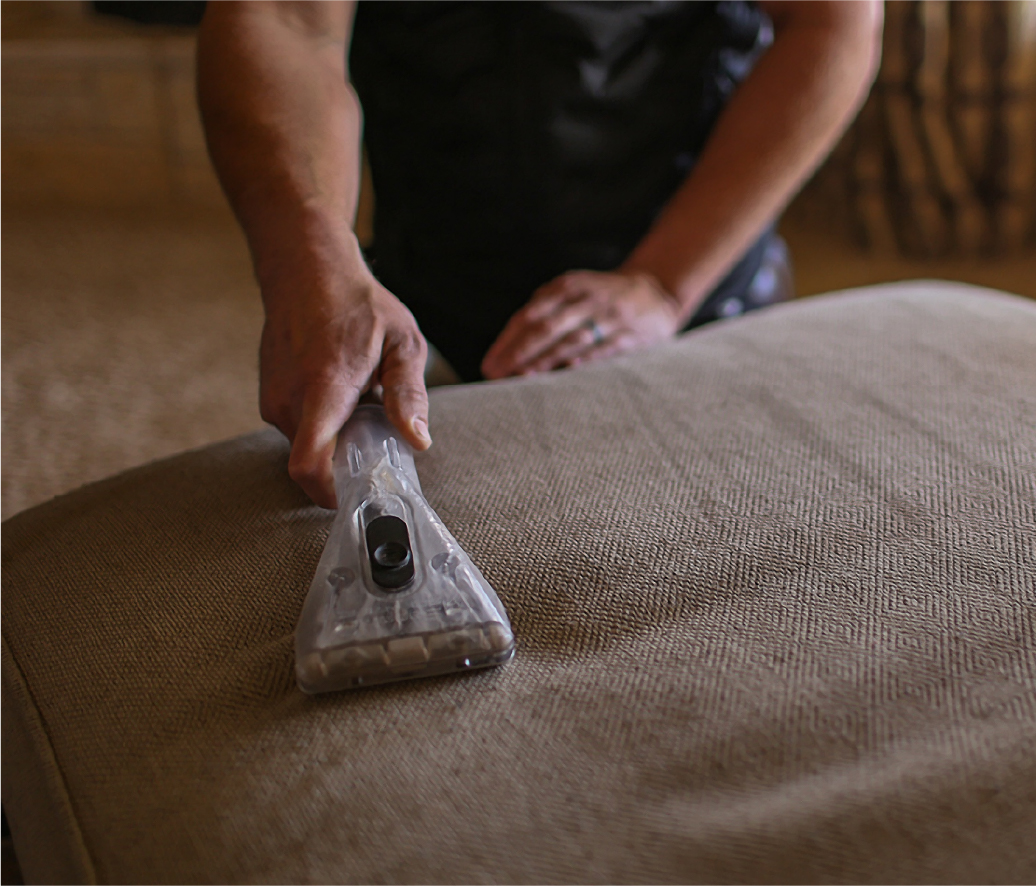 Technician cleaning upholstery