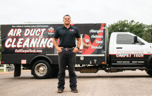 Air Duct Technician in front of Truck