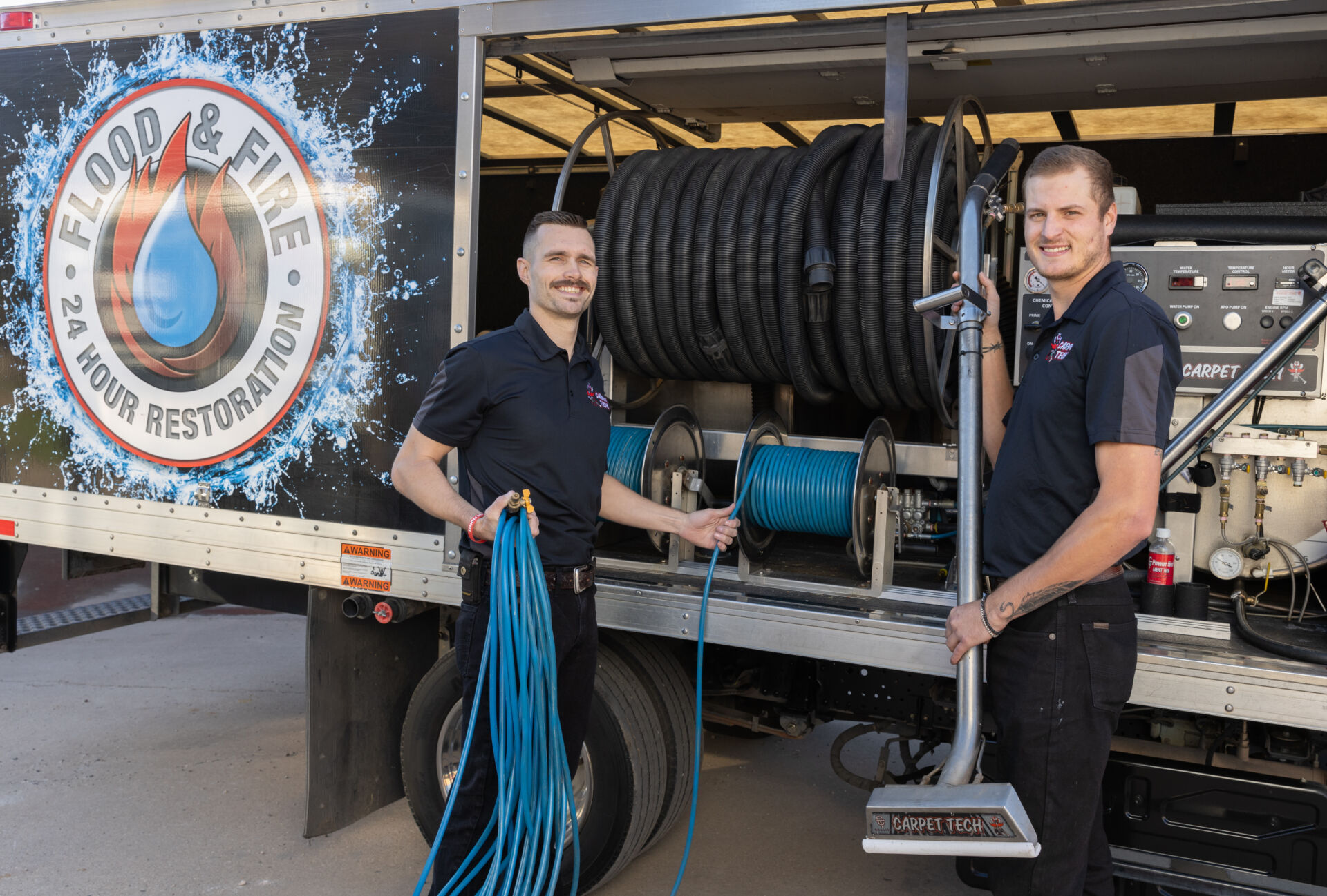 Carpet tech technicians using carpet cleaning equipment