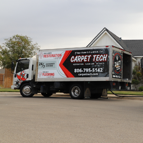 Carpet Cleaning rig outside a home.